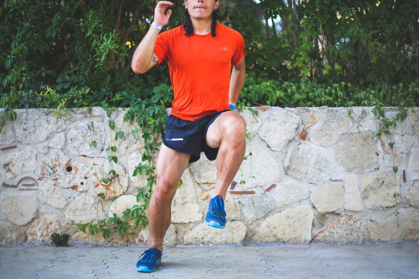 Trail runner performing a lateral jump