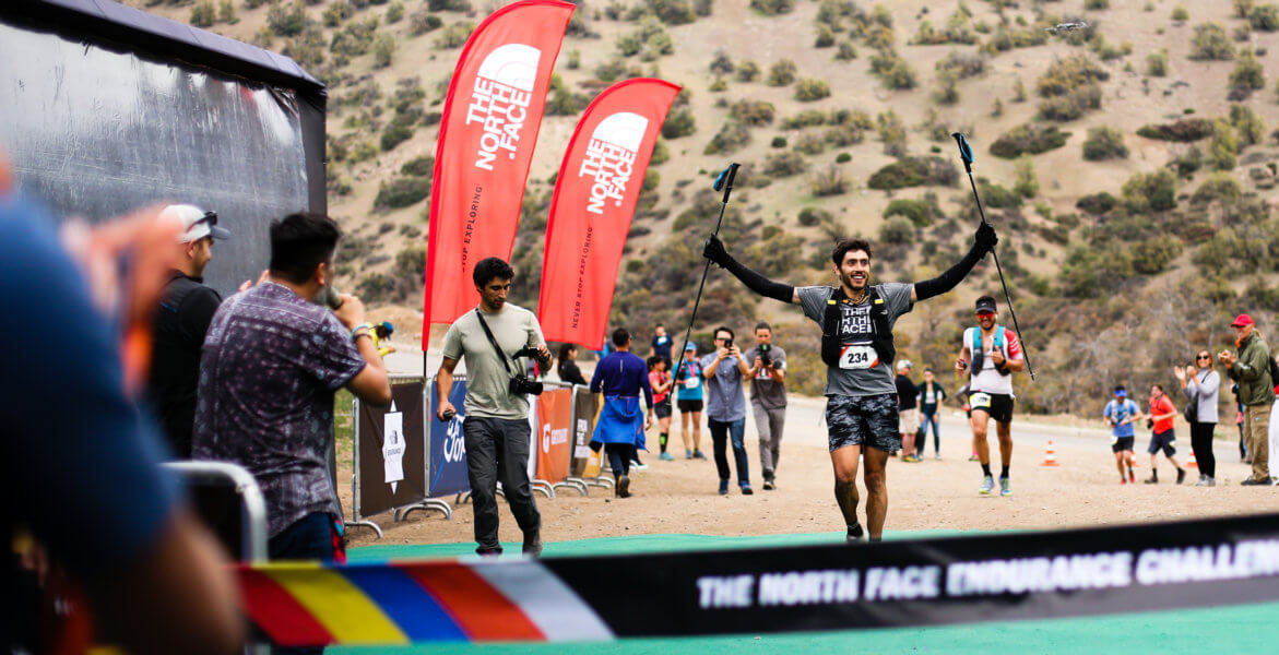 trail runner finishing a 100k ultramarathon