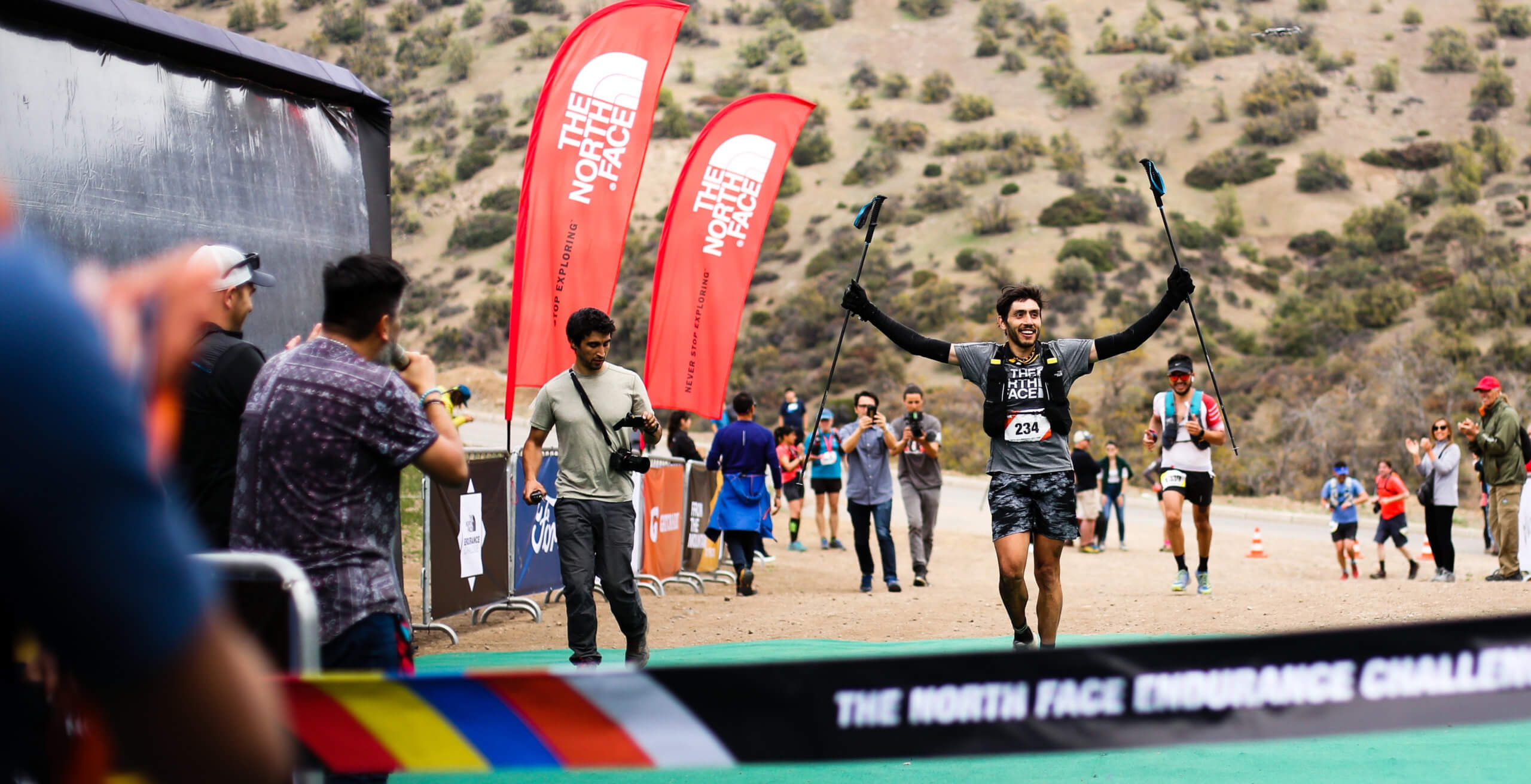 trail runner finishing a 100k ultramarathon
